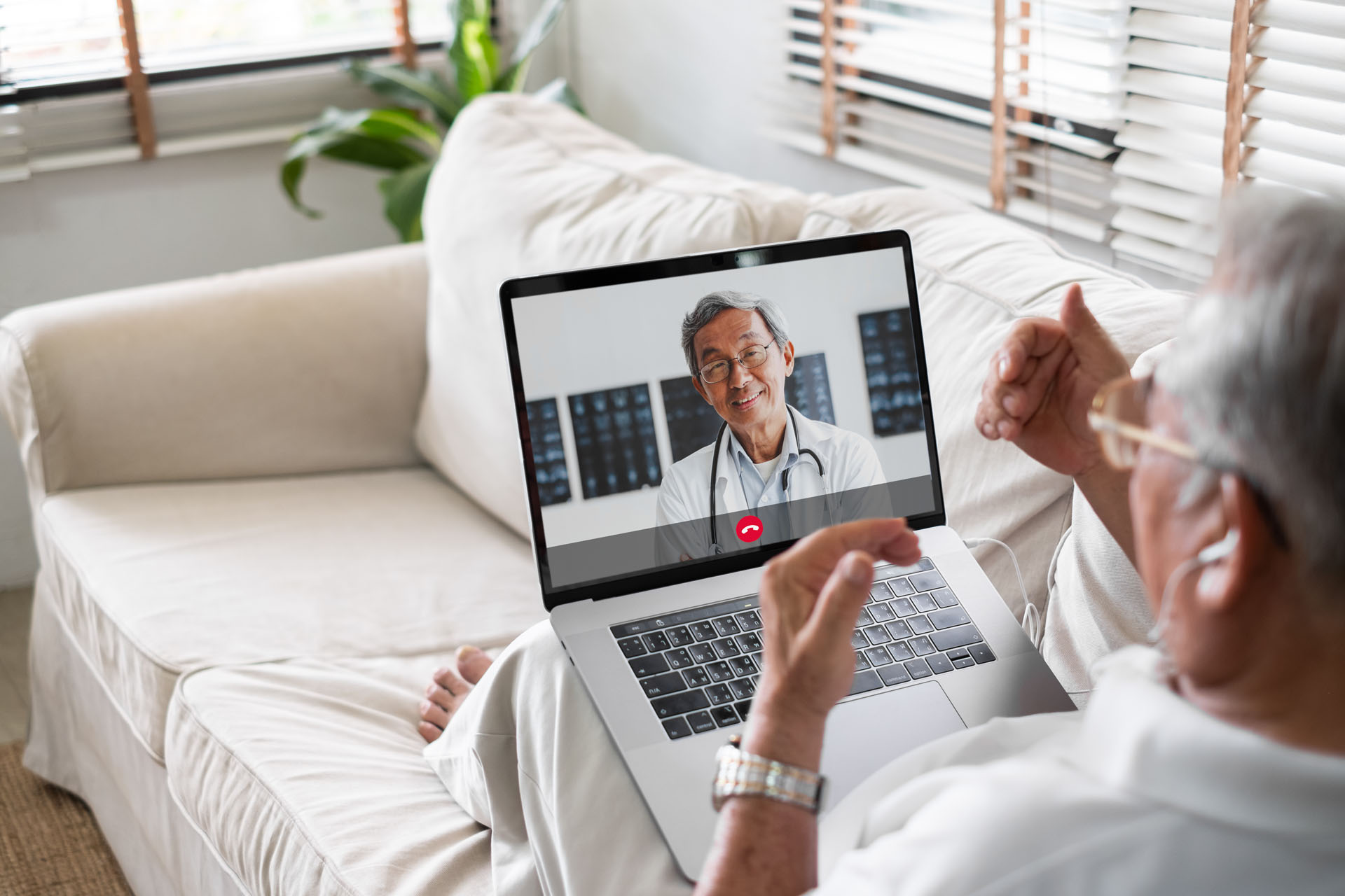 Asian senior video call with doctor telemedicine