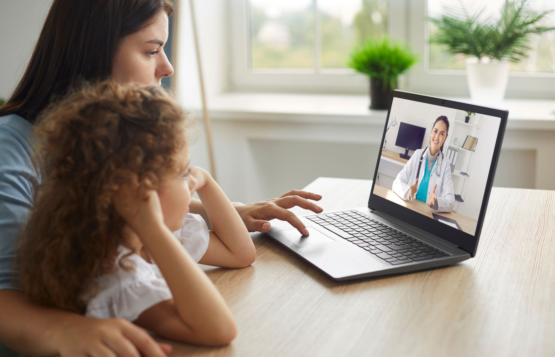 Healthy,Mother,And,Child,Enjoying,Digital,Era,,Having,Online,Telemedicine Healthy mother and child enjoying digital era, having online telemedicine consultation with remote doctor or watching educational video by professional paediatrician about cold and flu virus treatment