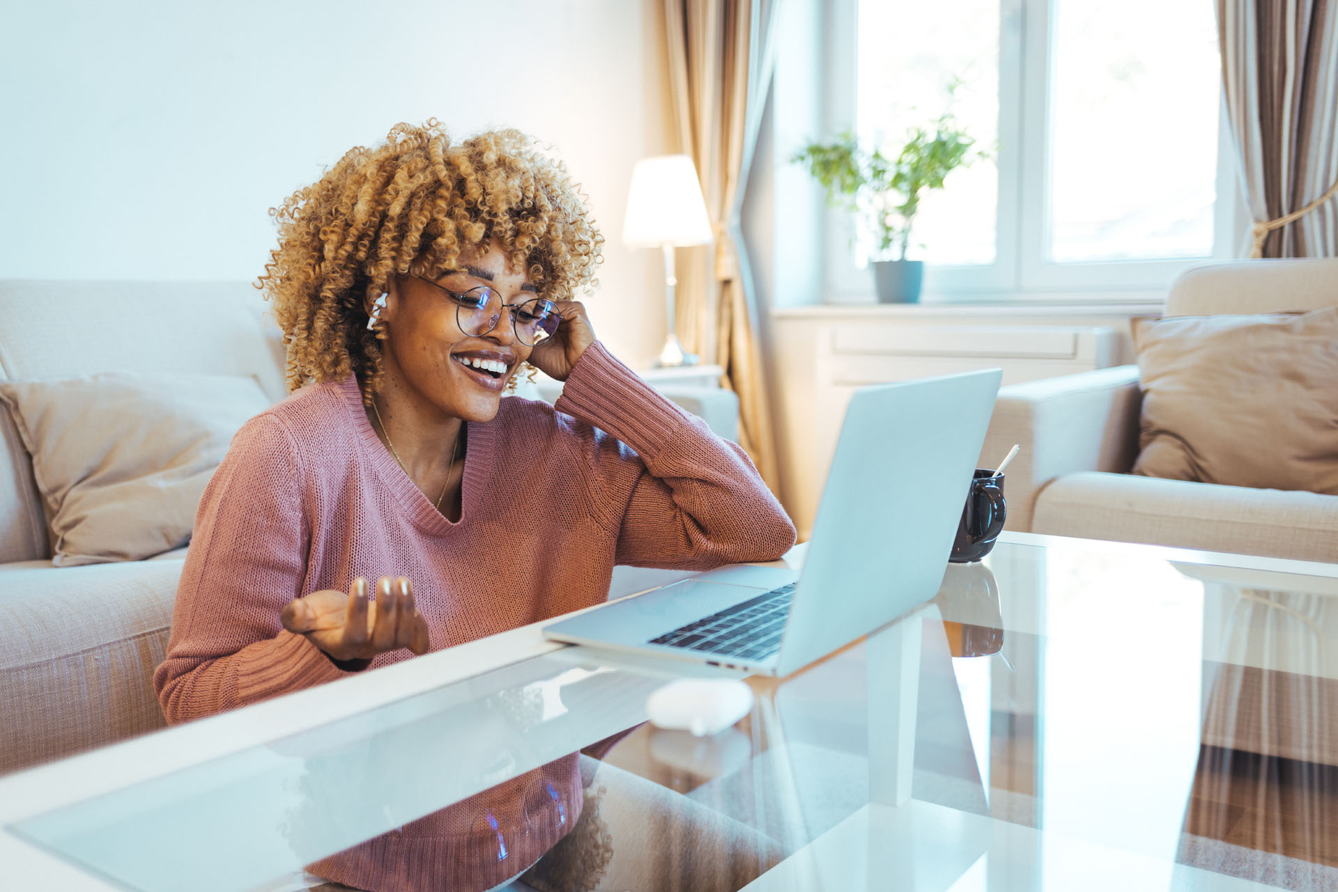 Smiling,Young,African,American,Teen,Girl,Wear,Headphones,Video,Calling Smiling young african american teen girl wear headphones video calling on laptop. Happy mixed race pretty woman student looking at computer screen watching webinar or doing video chat by webcam.